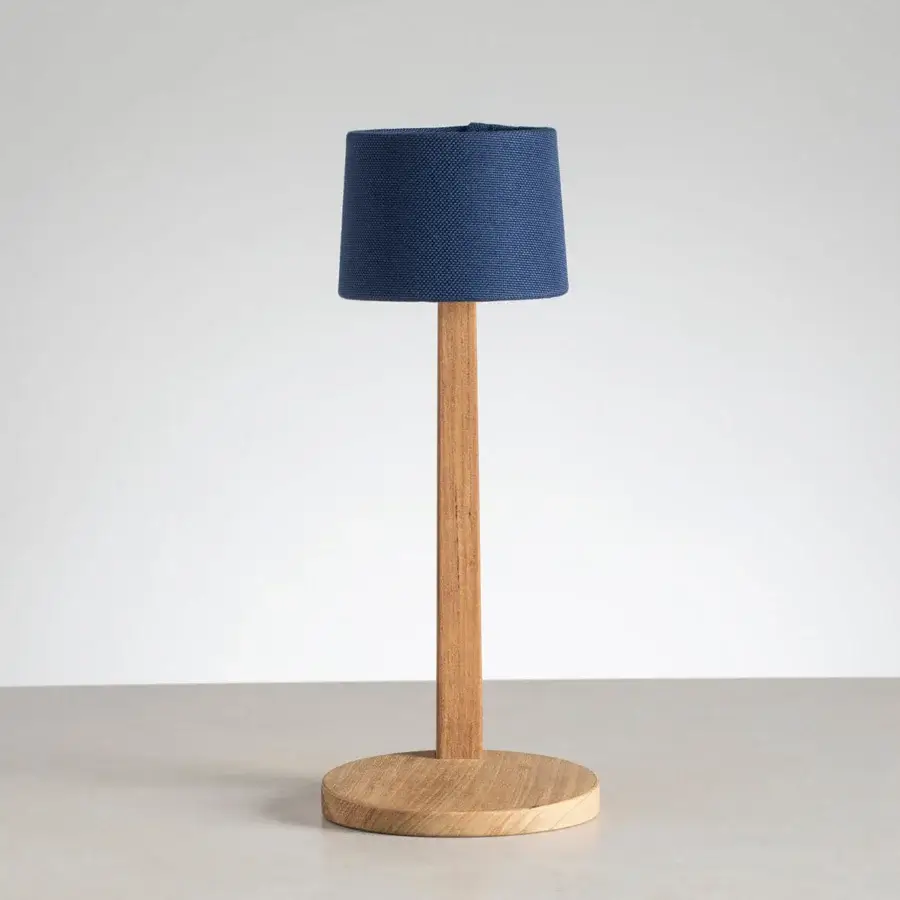 Elegant Ethimo Gaia table lamp crafted in wood with satin finish and deep blue woven textile shade