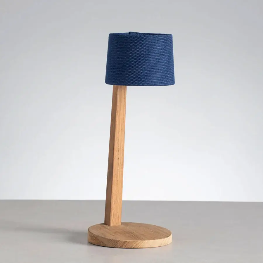 Distinguished Ethimo Gaia table lamp crafted in wood with satin finish and textured deep blue textile lampshade