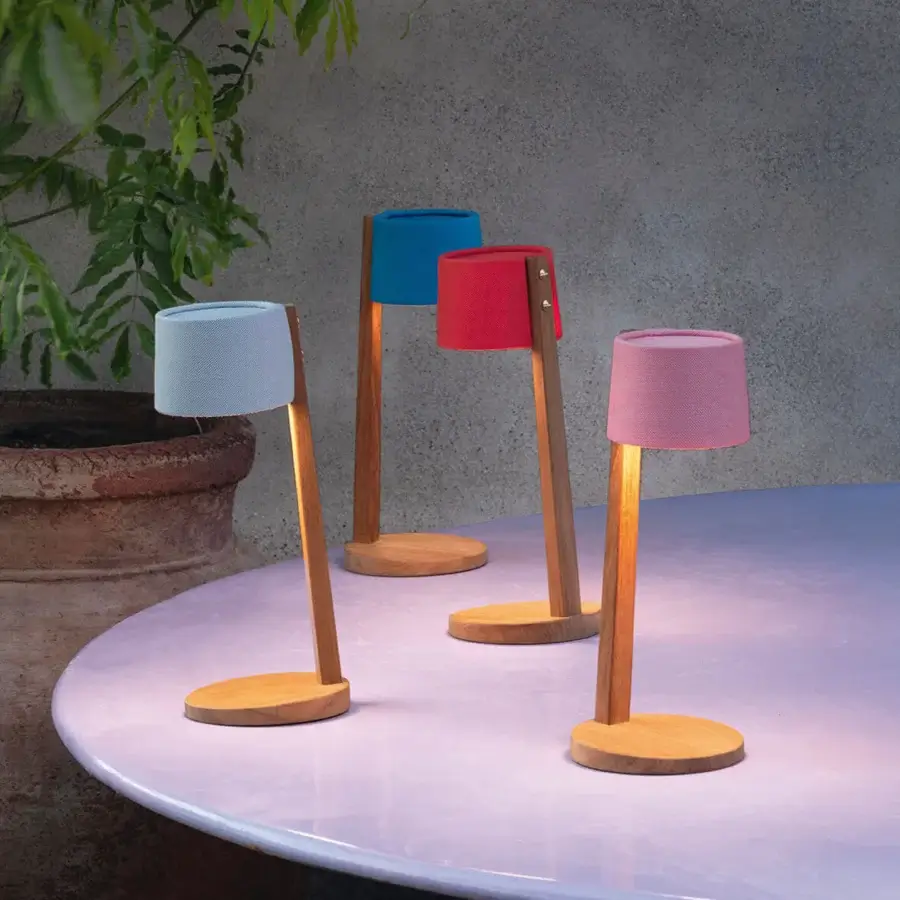 Exclusive Ethimo Gaia table lamp with satin-finish wood and vibrant light blue textile shade crafted for cordless illumination