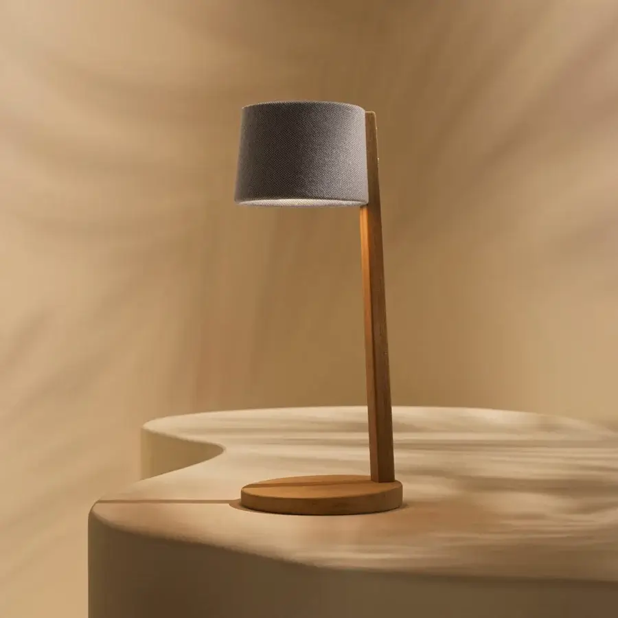 Distinguished Ethimo Gaia table lamp with warm medium-brown wood and muted gray textile, crafted with a satin finish