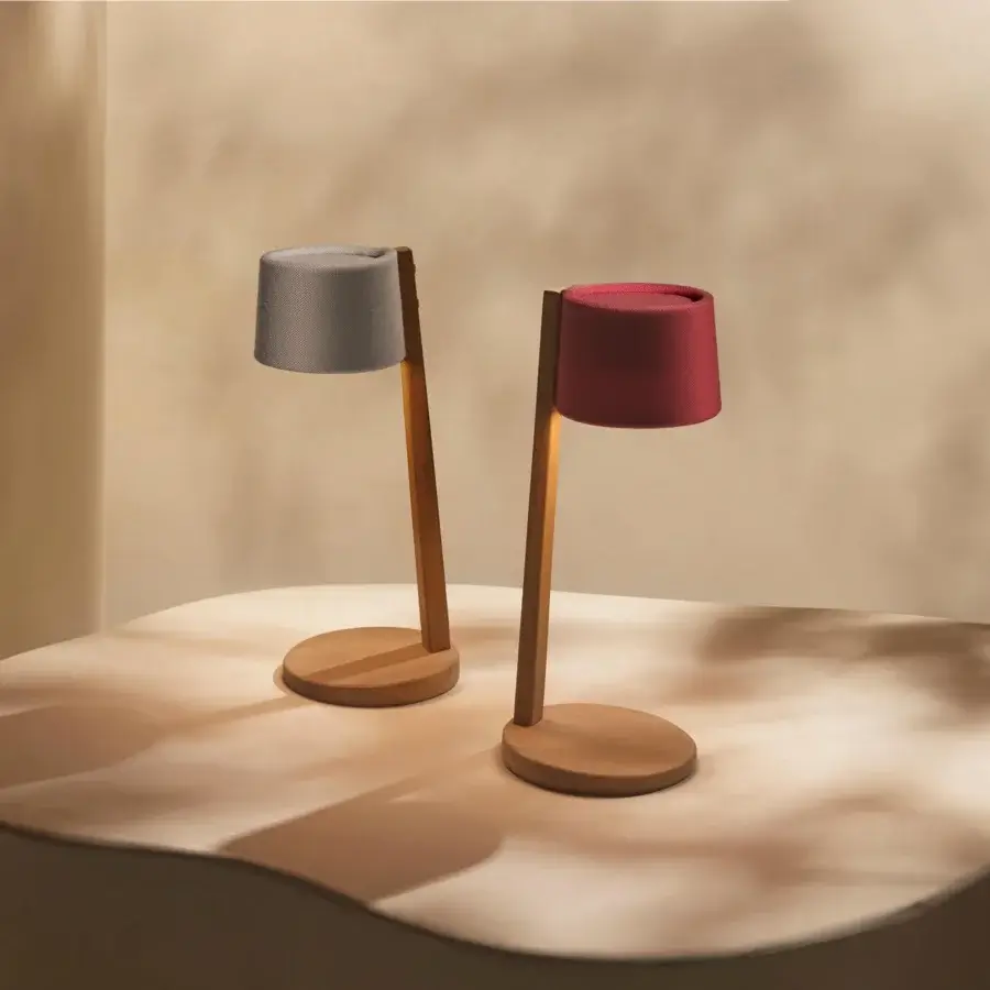 Exceptional Ethimo Gaia table lamp with warm medium-tone wood and subtly textured burgundy textile shade crafted for ambient illumination