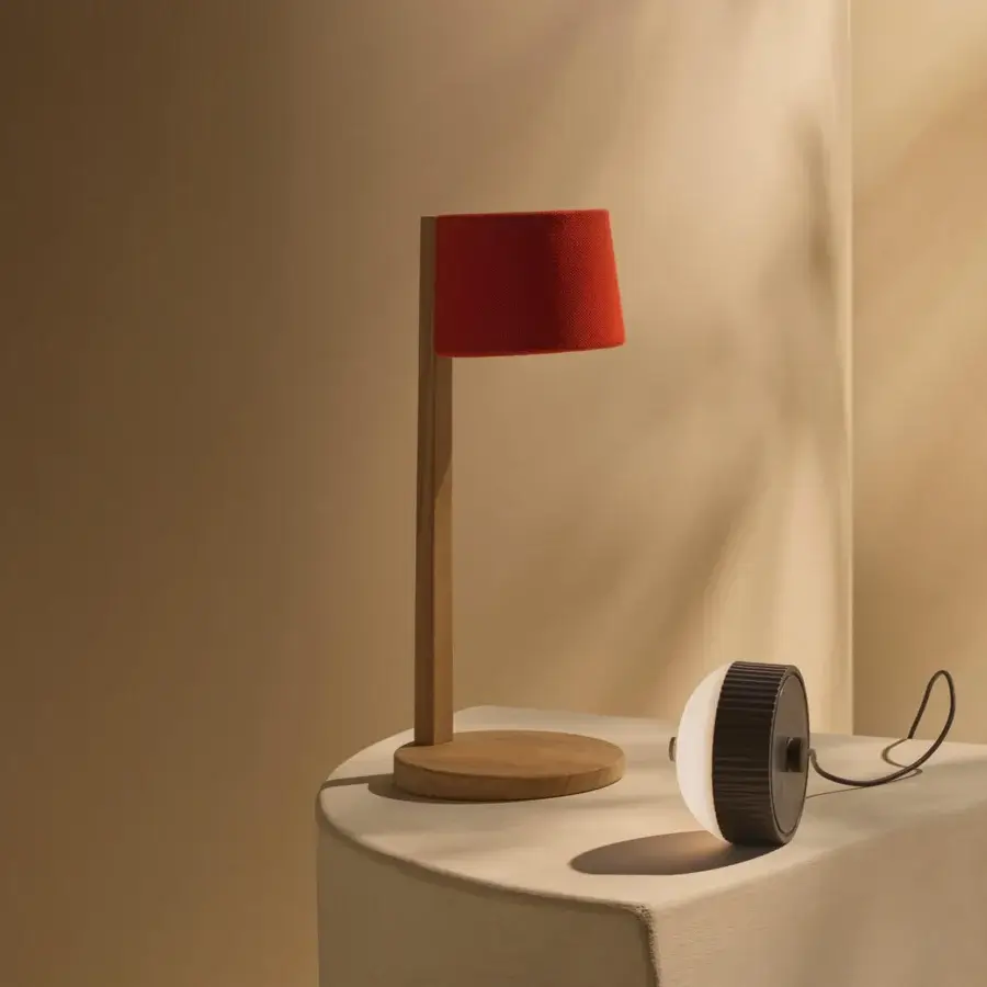 Superior Ethimo Gaia table lamp with a vibrant red textile shade and satin wood construction crafted in Italy