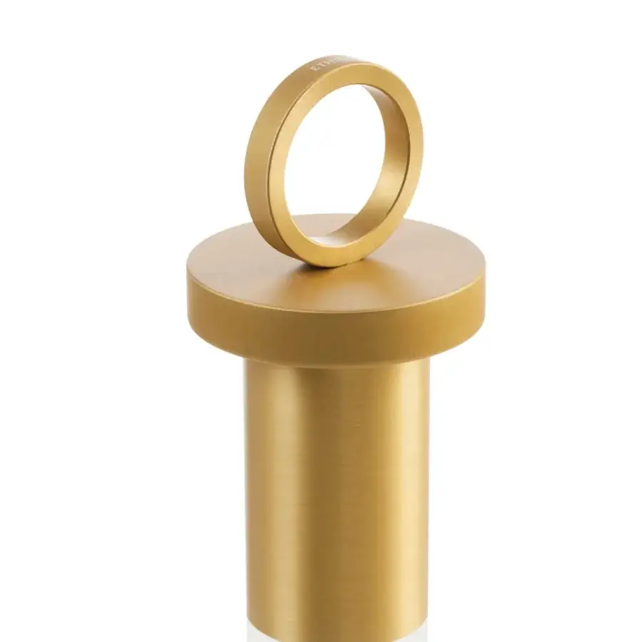 Exceptional Ethimo Lucerna table lamp with cylindrical form crafted in muted gold tone metal and satin finish