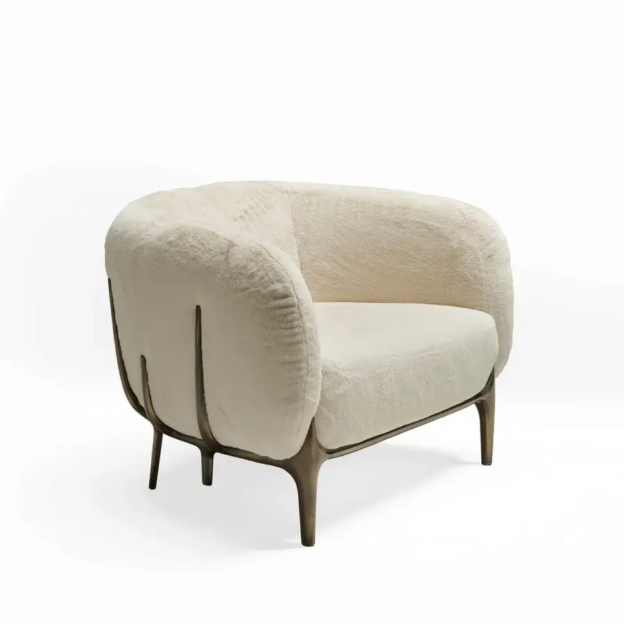 Lavish Zanaboni Blanca lounge chair with black-stained ash wood structure and off-white bouclé upholstery