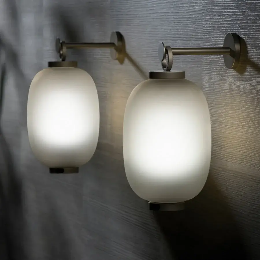 Distinguished Ethimo Lucerna wall lamp reimagines a Roman oil lamp with glass and muted-tone metal in a matte finish