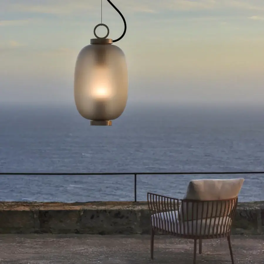 Superior Ethimo Lucerna suspension lamp crafted in translucent frosted glass with golden-toned metallic trim for atmospheric outdoor illumination