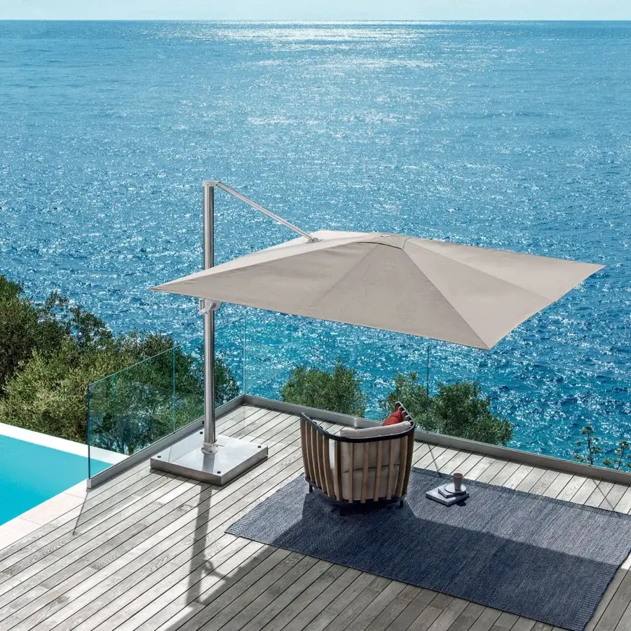 Exceptional Ethimo Freedom umbrella crafted in neutral beige with a sleek silver-grey metal frame for adjustable outdoor coverage