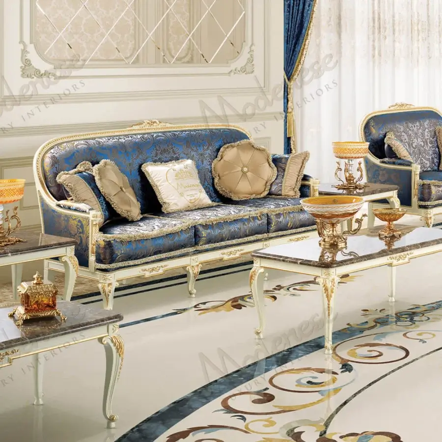 Sumptuous Modenese Midnight Moon sofa upholstered in deep blue fabric with intricate embroidery and gold leaf accents