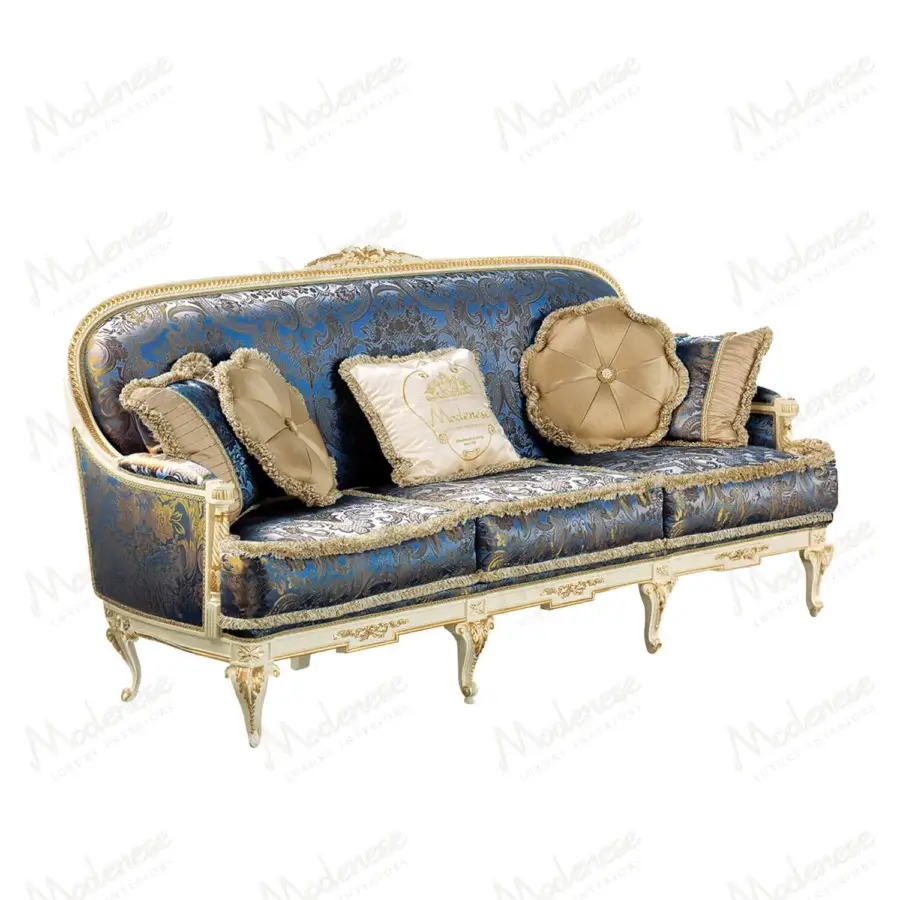 Exceptional Modenese Midnight Moon sofa upholstered in sumptuous deep blue fabric with hand-carved gold leaf accents