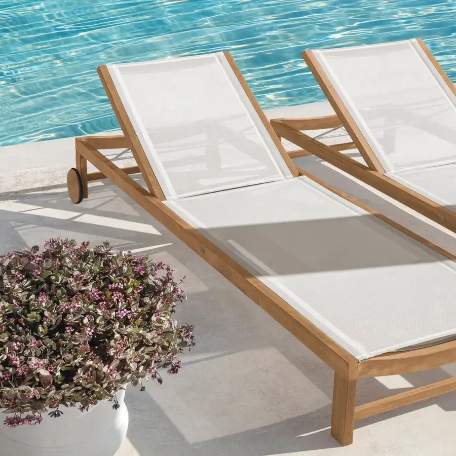Exceptional Ethimo Sand lounger crafted in Italy with warm brown wood and bright white textile construction