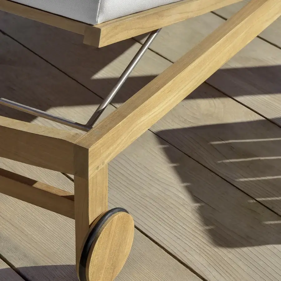 Distinguished Ethimo Sand lounger crafted in Italy with warm medium-toned wood and a smooth satin finish