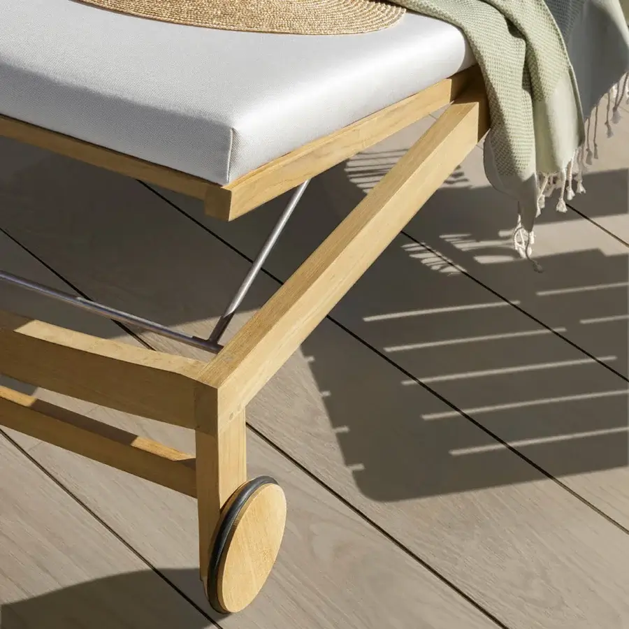 Superior Ethimo Sand lounger crafted in Italy with light wood, a satin finish and plush white cushioning