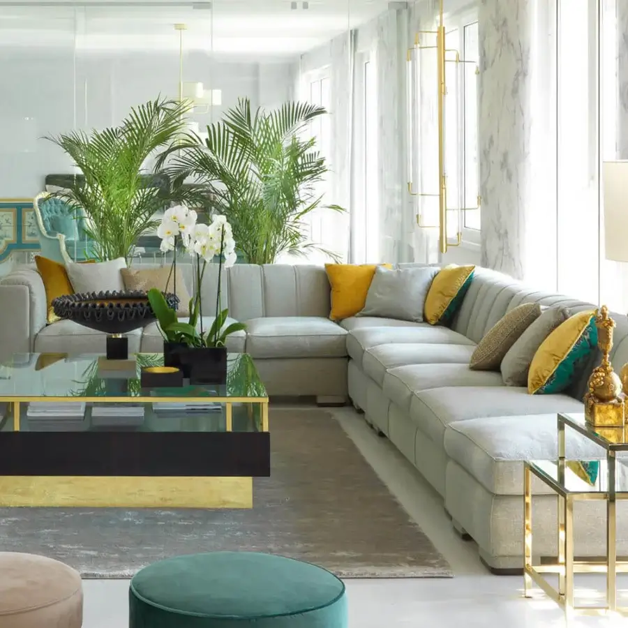 Lavish Zanaboni Magritte sectional with neutral gray velvet padding and vibrant cushions in gold-finish metal accents