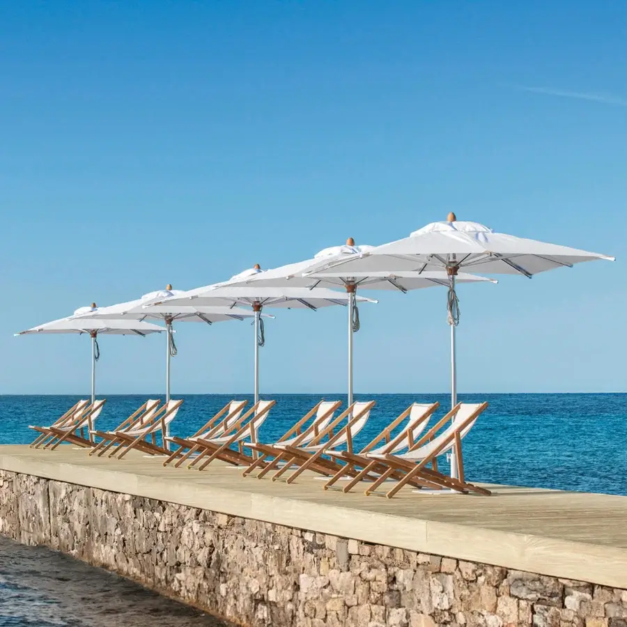 Distinguished Ethimo Free Umbrella parasol in white textile with a satin metal structure embodies contemporary Italian design