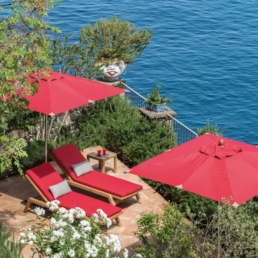 Exceptional Ethimo Free Umbrella parasol in red with a matching metal frame embodying a contemporary aesthetic