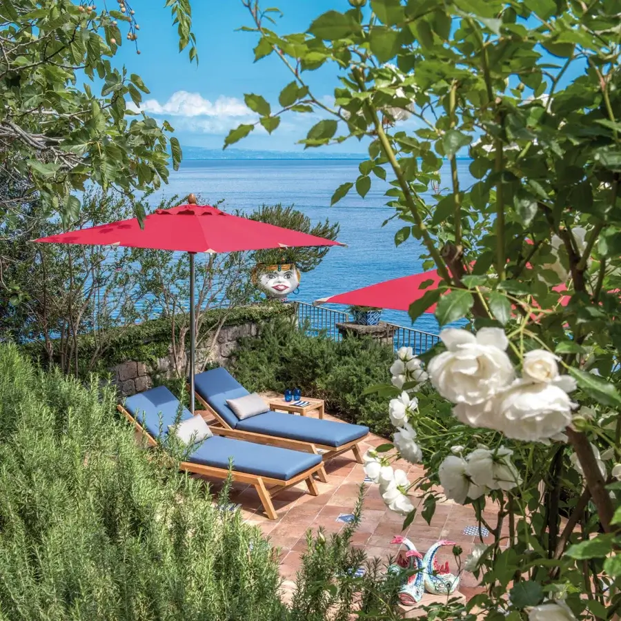 Distinguished Ethimo Free Umbrella parasol in vibrant red textile with a sleek silver-toned metal pole crafted in Italy