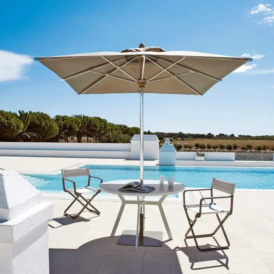 Superior Ethimo Free Umbrella parasol in light beige with a matte metal frame embodying minimalist lines