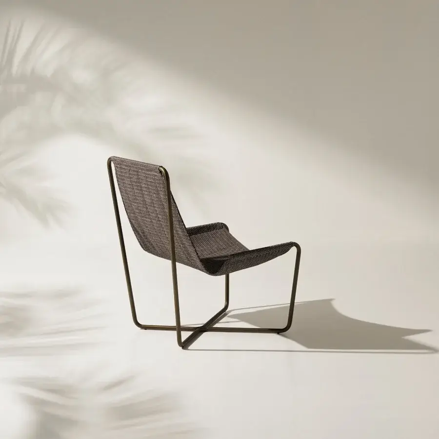 Exceptional Ethimo Sling lounge chair with a dark matte metal frame and textured dark charcoal gray textile weaving