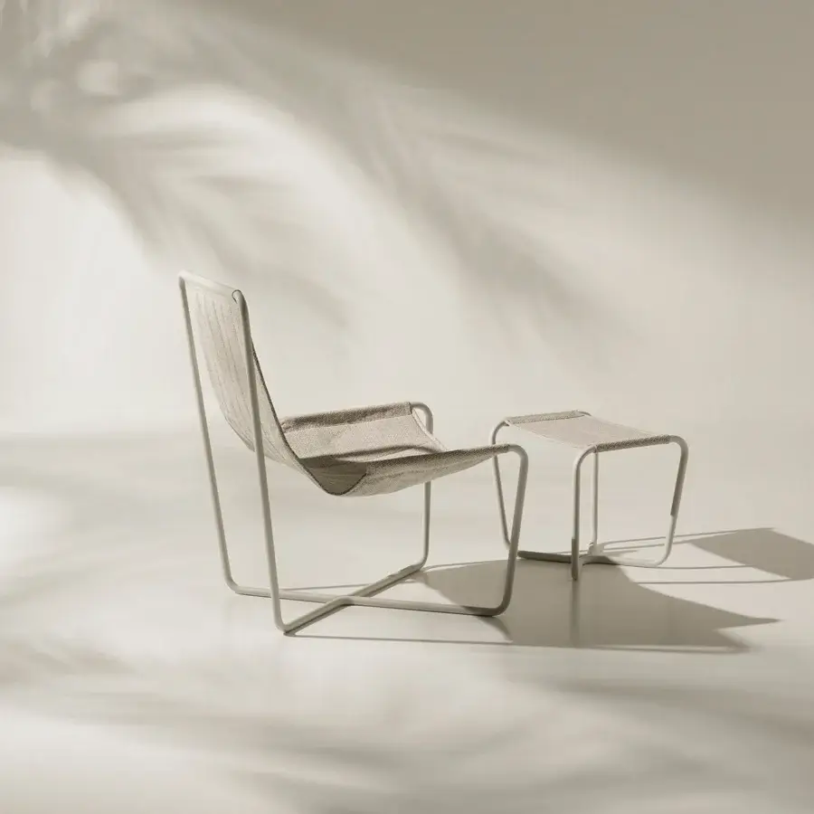 Superior Ethimo Sling lounge chair with a sleek metal frame and woven textile in a muted neutral palette