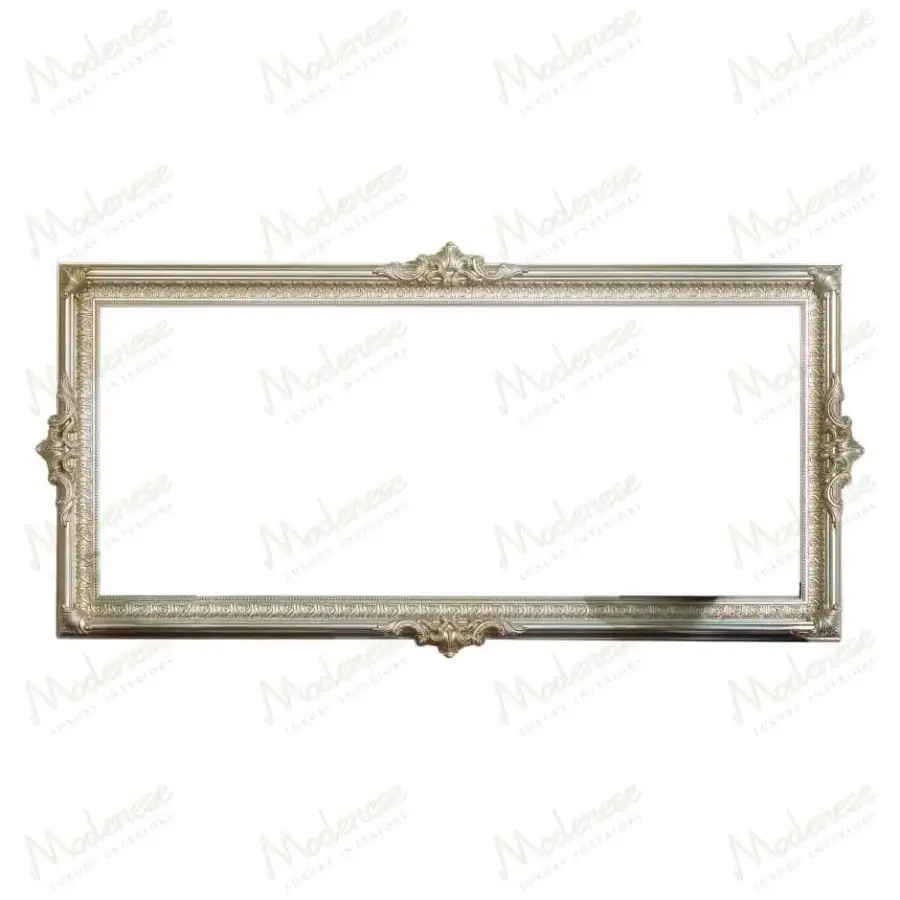 Remarkable Modenese Noble Etiquette mirror crafted in silver-tone metal with graceful curves and delicate relief work