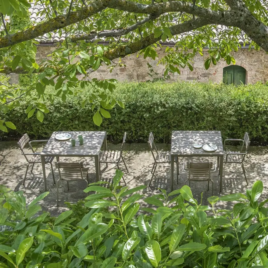 Sophisticated Ethimo Laren chair with woven textile and matte grey-green metal, crafted in Italy