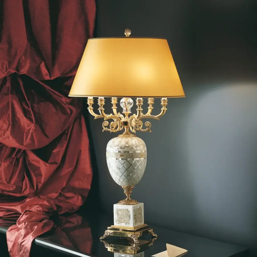 Exquisite Laudarte Ulmus table lamp with gilded metal base, textured column and warm golden-yellow lampshade crafted by Italian artisans