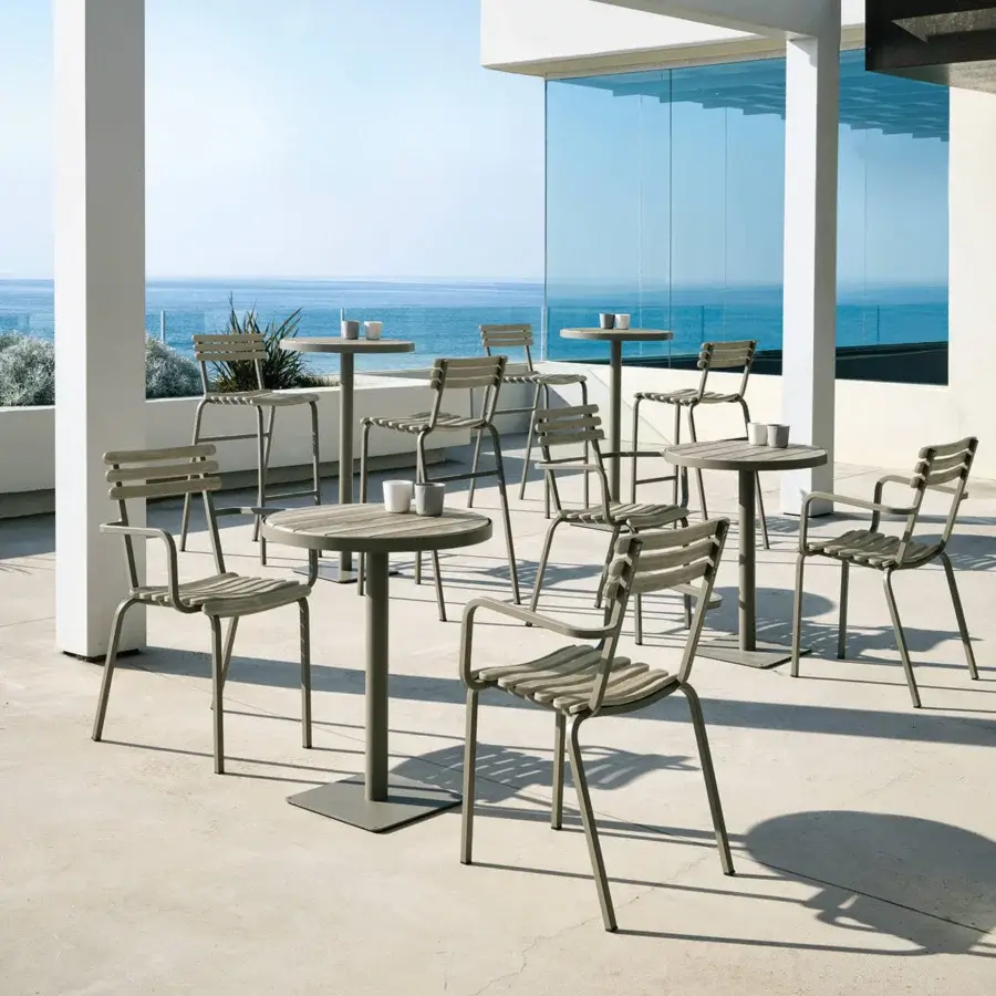 Sophisticated Ethimo Laren armchair crafted in metal with smooth matte finish embodies a contemporary minimalist aesthetic in grey-green tone