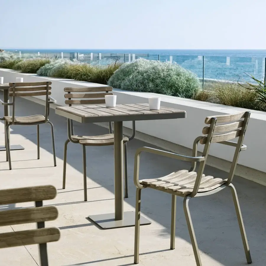 Exceptional Ethimo Laren armchair with light grey metal and medium-toned brown wooden slats offers a refined minimalist aesthetic