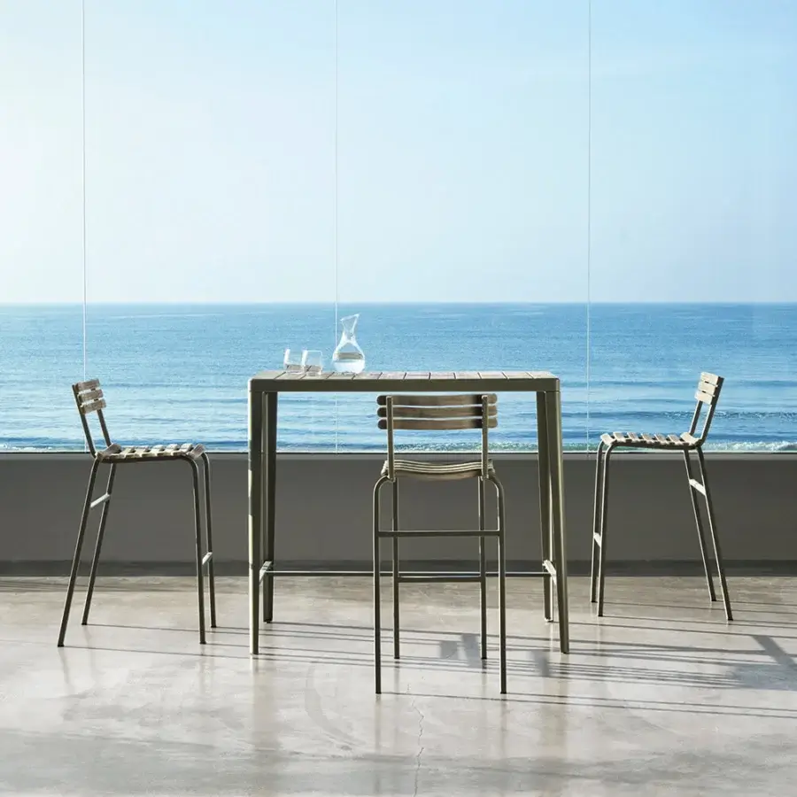 Sophisticated Ethimo Laren bar table with sleek metal frame and warm teak slats in muted olive green matte finish