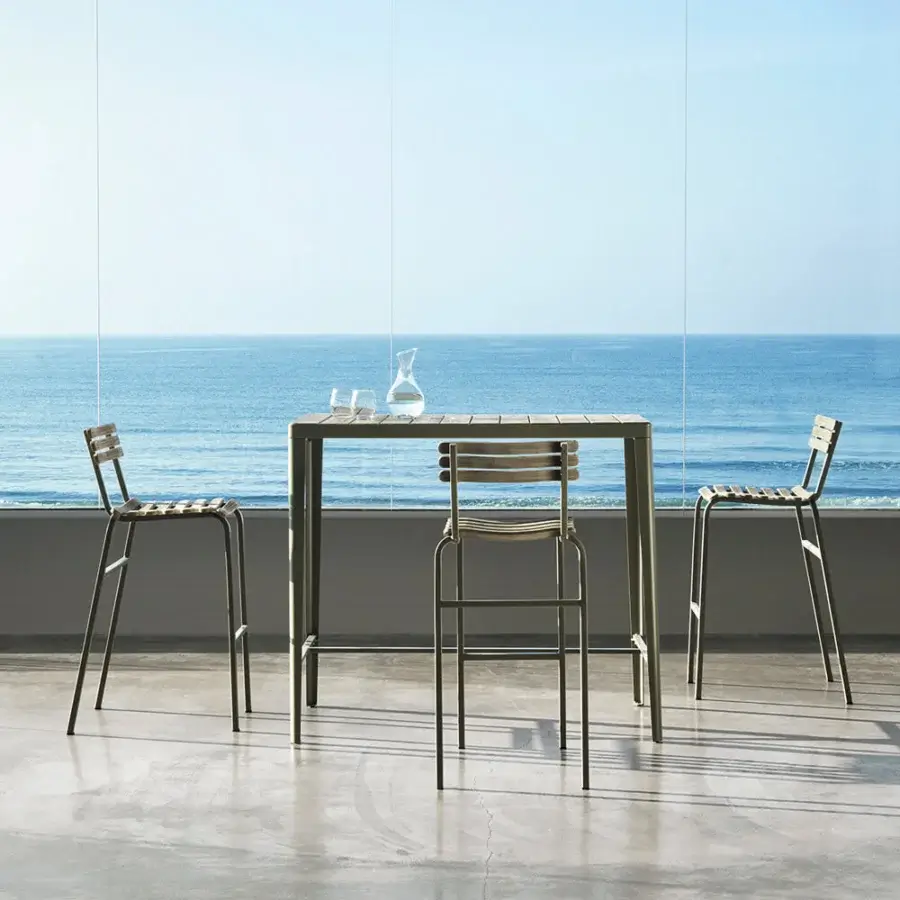 Distinctive Ethimo Laren stool with a sleek grayish-green metal frame and slatted back built in Italy with a matte finish