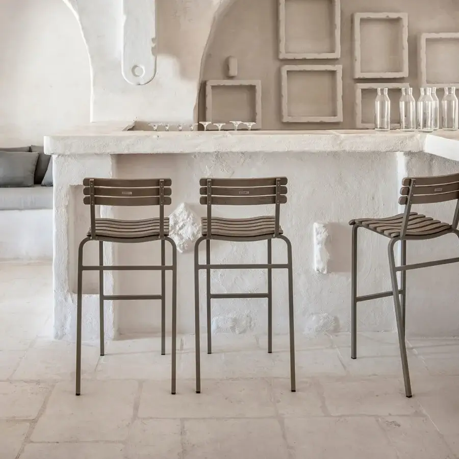 Refined Ethimo Laren stool with sleek metal frame and woven seat and backrest in a muted grayish-brown finish