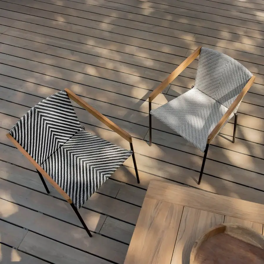 Superior Ethimo Allaperto Bistrò armchair crafted with wood frame, metal legs, and a black and white zigzag textile weave with satin and matte finish