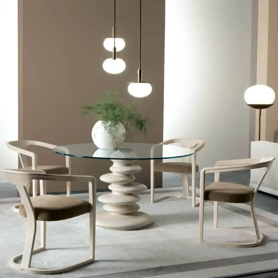 Distinguished Zanaboni Ometto table with clear glass top and pale beige stone-like composite base, matte finish