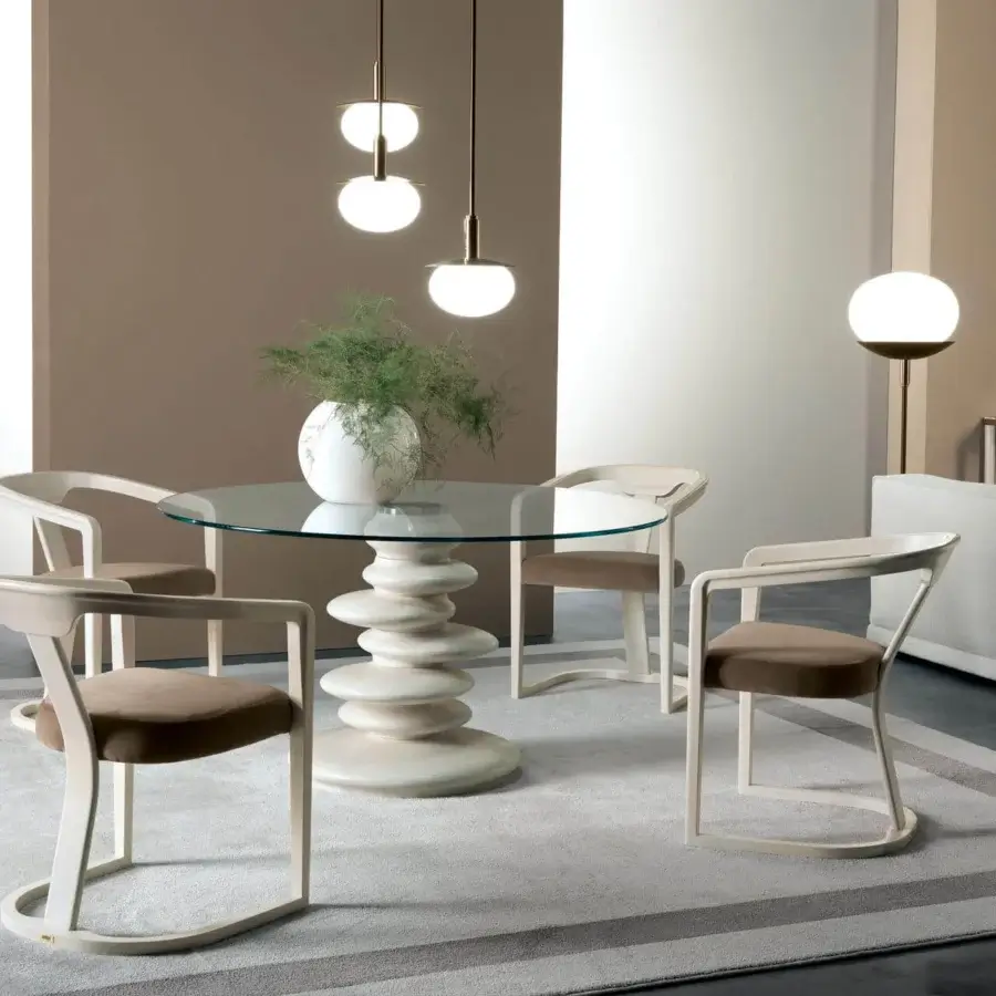 Elegant Zanaboni Ometto table with clear glass top and textured, muted beige cylindrical base crafted from synthetic material