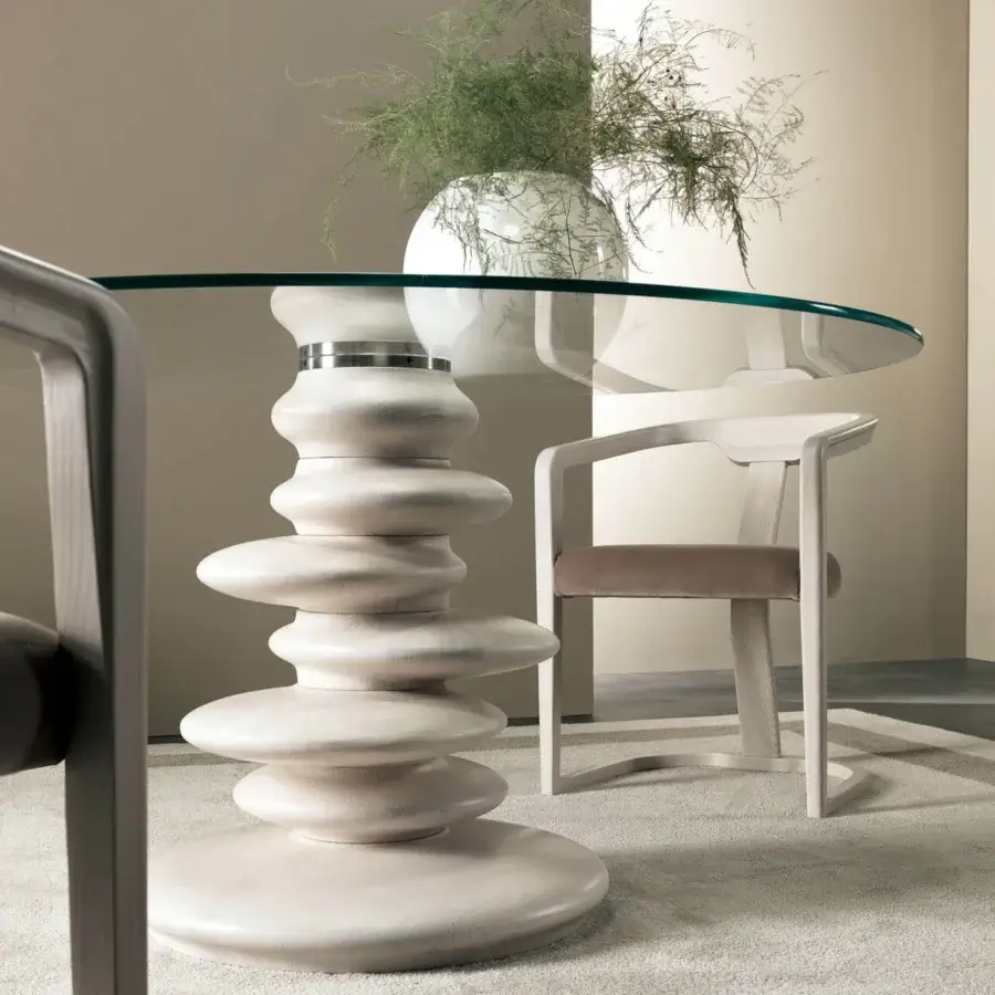 Superior Zanaboni Ometto table with sculpted wood-like discs in pale beige supporting a clear glass top and matte finish