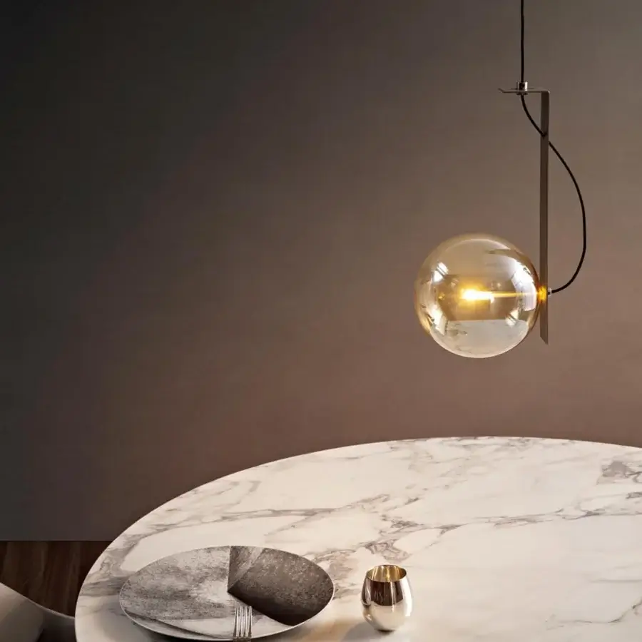 Refined Bonaldo Bon Ton suspension lamp in translucent amber glass with a brushed nickel metal support