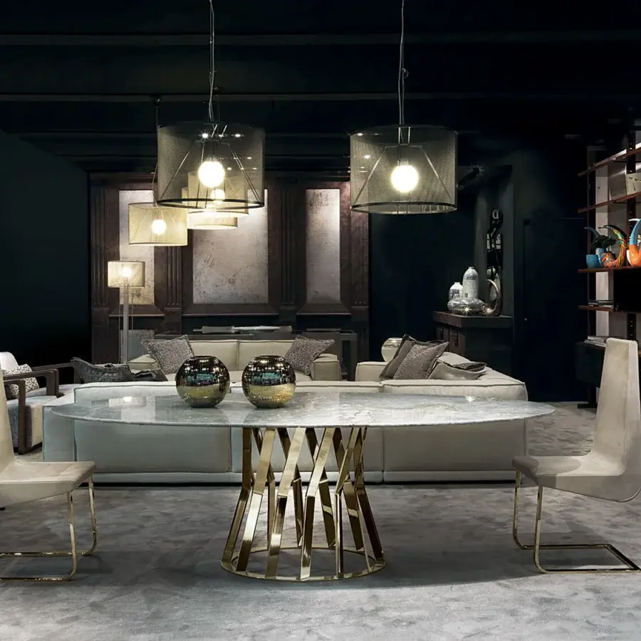 Elegant Zanaboni Ray table with an oval marble top and complex bronzed metal base exhibiting a forward-thinking design