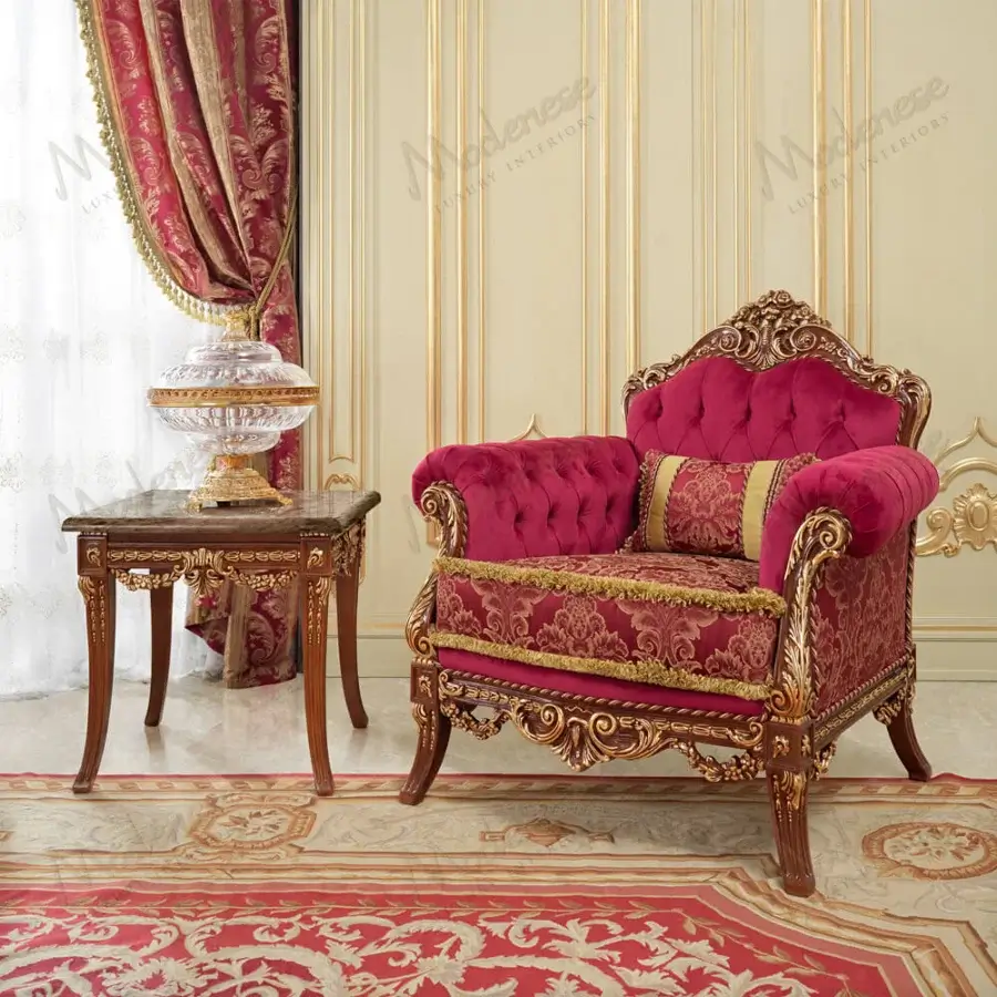 Distinguished Modenese Rubino Delight lounge chair upholstered in ruby-red velvet with intricate gold damask and gold leaf finish
