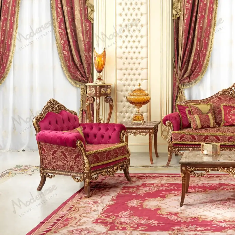 Sumptuous Modenese Rubino Delight lounge chair upholstered in ruby-red velvet with gold leaf finished wood frame