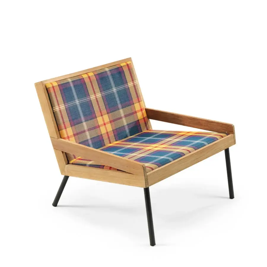 Sophisticated Ethimo Allaperto lounge chair in Italy with wood frame and vibrant plaid cushions offering chromatic contrast