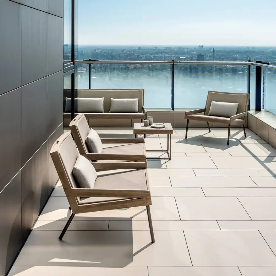 Elegant Ethimo Allaperto lounge chair with a satin-finish wood frame and neutral beige woven fabric construction