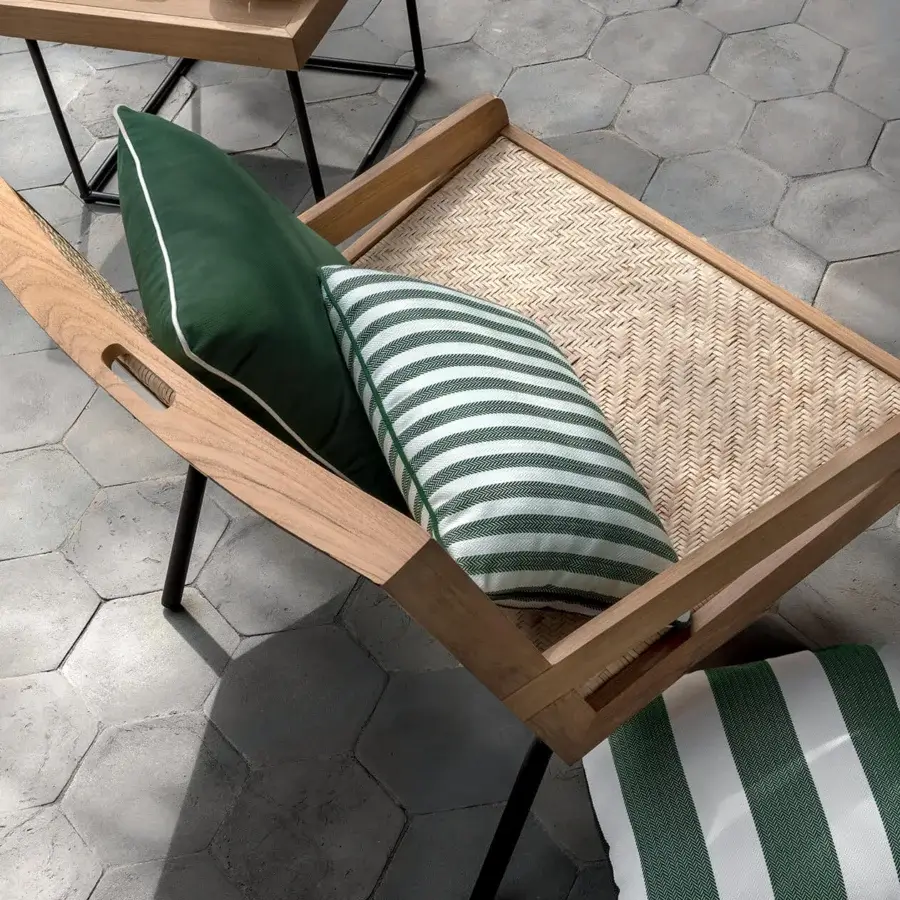 Lavish Ethimo Allaperto lounge chair crafted in medium-brown wood with satin finish and woven seat with green and white striped cushion