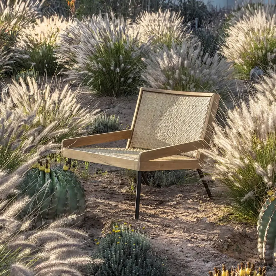 Exceptional Ethimo Allaperto lounge chair with woven natural fiber seat and satin-finish wood frame crafted in Italy