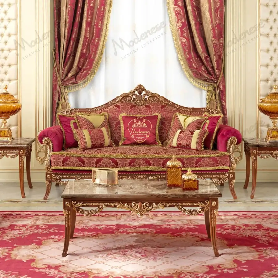 Exquisite Modenese Rubino Delight sofa upholstered in ruby-red fabric with gold embroidery and opulent gold leaf detailing