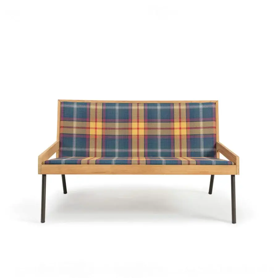 Sophisticated Ethimo Allaperto two-seater sofa crafted with a smooth satin wood frame and matte metal legs in a striking plaid textile