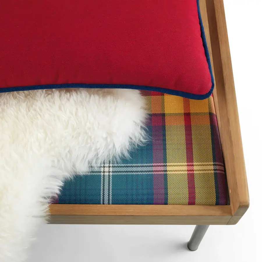 Distinguished Ethimo Allaperto two-seater sofa built with light to medium brown wood, red upper cushion with blue trim, and patterned textile