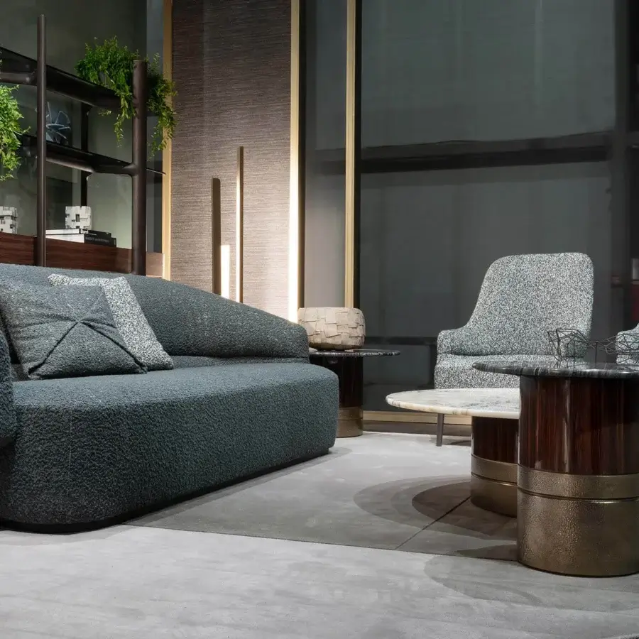 Sophisticated Zanaboni Alma sofa upholstered in muted gray-blue textile with a refined grey stained ash wood base