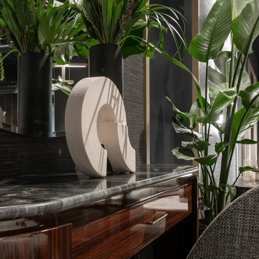Elegant Zanaboni Bea dresser built with striped glossy rosewood, dark marble, and a black lacquered base