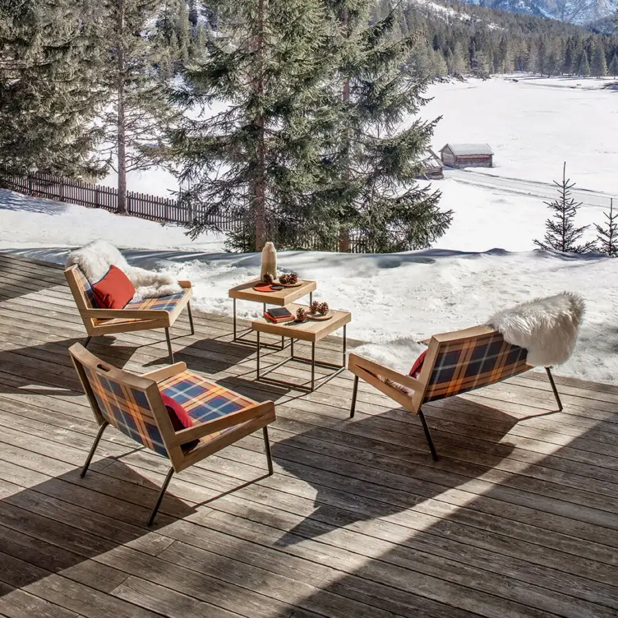 Superior Ethimo Allaperto coffee table with a warm brown wooden tabletop and dark matte metal frame built for outdoor use