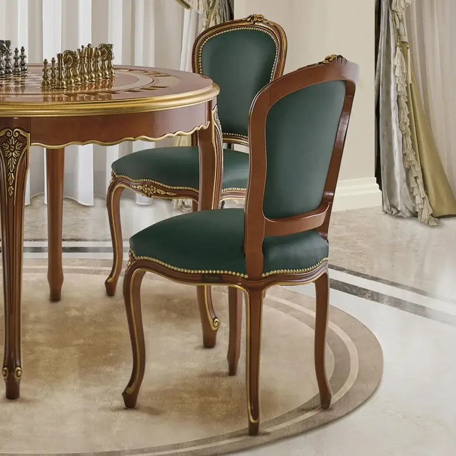Distinguished Modenese Royal Blend chair with deep green leather upholstery and ornate golden detailing in a rich walnut finish